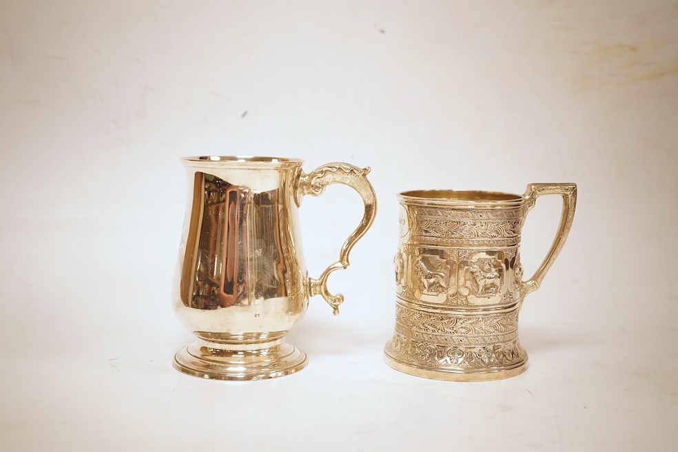 A George III silver baluster mug, Peter & Ann Bateman?, London, 1797, height 10.6cm, together with a late Victorian embossed silver christening mug, Glasgow, 1893, 12.2oz.